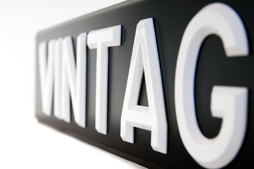 Raised White Digits on Black Number Plates